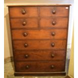 A large Victorian mahogany chest, having four short and four graduated long drawers, on a plinth