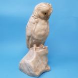 A carved alabaster figure, of an owl, perched on a rock, 28 cm high, removal cost A Report by RB The