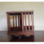 An Edwardian inlaid mahogany table top revolving bookcase, 36 cm square, removal cost A Report by RB