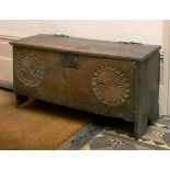 A 17th century carved oak six plank coffer, with later blacksmith made shaped iron hinges, 93 cm