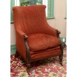 A 19th century upholstered library armchair, on leaf capped tapering fluted front legs, removal cost