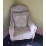 An early 20th century upholstered armchair, on turned front legs, removal cost B