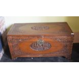 A Chinese carved camphorwood chest, 94 cm wide, removal cost B