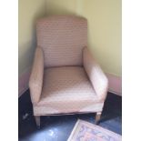 An Edwardian upholstered armchair, on tapering square legs, removal cost B