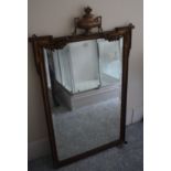 A gilt gesso mirror, with an urn and floral swag finials, 80 cm wide x 130 cm high, removal cost B