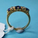 An 18ct gold, sapphire and diamond five stone ring, approx. ring size L½