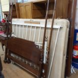 A modern mahogany four poster bed and a Victorian style cast metal bed frame (2)