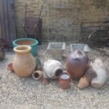 A garden terracotta amphora, 70 cm high, nine other garden pots, four green metal garden chairs