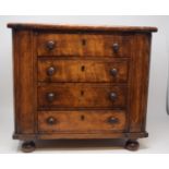 A Victorian table top chest, of four drawers, on turned feet, 39.5 cm wide