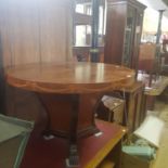 A circular coffee table, and a oak pot cupboard (2)