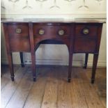 An early 19th century mahogany serpentine front sideboard, on tapering square legs, 139 cm wide