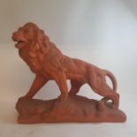 A Chinese pottery vase lamp, 59 cm high, a terracotta lion, and other items