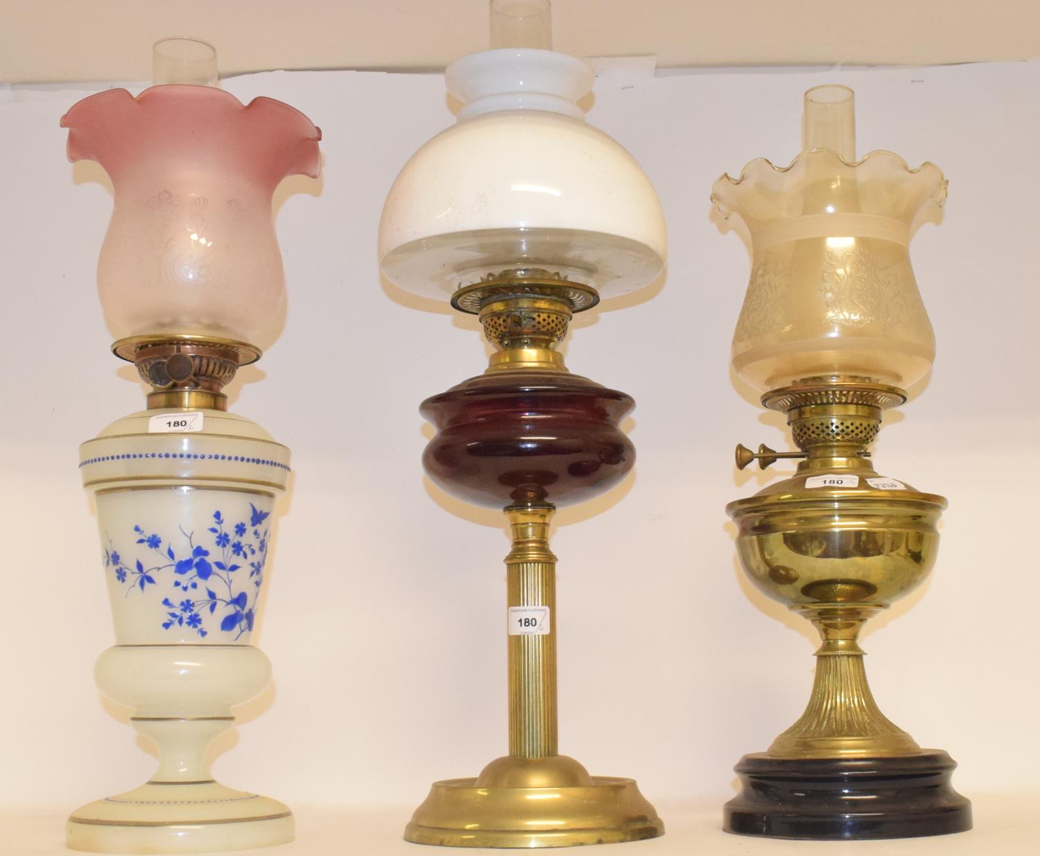 A late 19th/early 20th century brass oil lamp, with engraved glass shade, four other oil lamps and a - Image 2 of 2