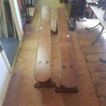 A pair of 18th/19th century oak benches, on solid supports and sledge feet, 183 cm wide (2) Report