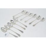 A set of twelve silver old English pattern dessertspoons, crested to match, various dates and