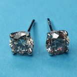 A pair of white gold and diamond stud earrings, 80 points Gold untested