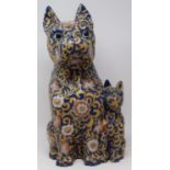 A pair of pottery lamps, 35 cm high over fitments, and a pottery dog group (3) Overall condition