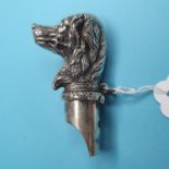A novelty silver dog whistle and vesta case