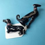 An Art Deco style black enamel dog brooch, and another similar (2)