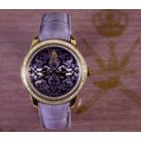 A gentleman's 18ct gold Omani presentation William & Son, London, wristwatch, the purple dial within