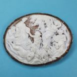An oval cameo brooch, carved an allegorical scene, in a silver coloured mount, glued, 6.5 cm wide