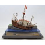 A model of a galleon, by B Grenville-Peter, dated 1994, in perspex case, 20 x 23 cm