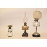An Art Deco silver plated oil lamp, with white glass well, and five others (6) No damage found to