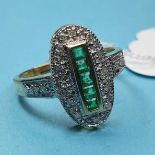 A 9ct gold ring, with five calibre cut emeralds and diamonds