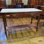 An early 20th century walnut side table, with a marble top, 107 cm wide