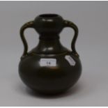 A Chinese green glazed pottery double gourd vase, with twin handles, 19 cm high generally good, a