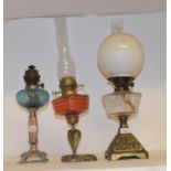 A late 19th/early 20th century glass and glass oil lamp, and nine others (10)