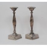A pair of modern silver hexagonal candlesticks, with baluster stems, Dublin 1966, with the