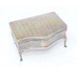 An early 20th century silver trinket box, initialled, and with engraved decoration, probably