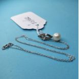 A white gold, diamond and cultured pearl pendant necklace