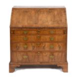 A walnut bureau, the fall front above four graduated long drawers, on bracket feet, 92 cm wide