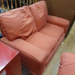 A pair of red two seater sofas (2)