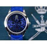 A gentleman's 18ct white gold Omani presentation William & Son, London wristwatch, with a blue dial,