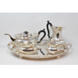An Edwardian silver plated four piece tea set, with pierced open work galleries, a similar tray