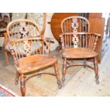 A pair of 19th century yew and elm Windsor chairs, pierced black back, raised on turned legs