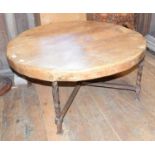 A 20th century oak and iron low table, 98 cm diameter