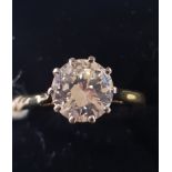 An 18ct yellow and white gold diamond solitaire ring, approx. ring size Q Report by RB Previously