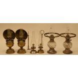 A pair of brass oil lamps, 30 cm high, another pair of oil lamps, and a pair of chambersticks (6)