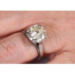 A white coloured metal and large diamond solitaire ring, approx. ring size N½ Report by RB From a