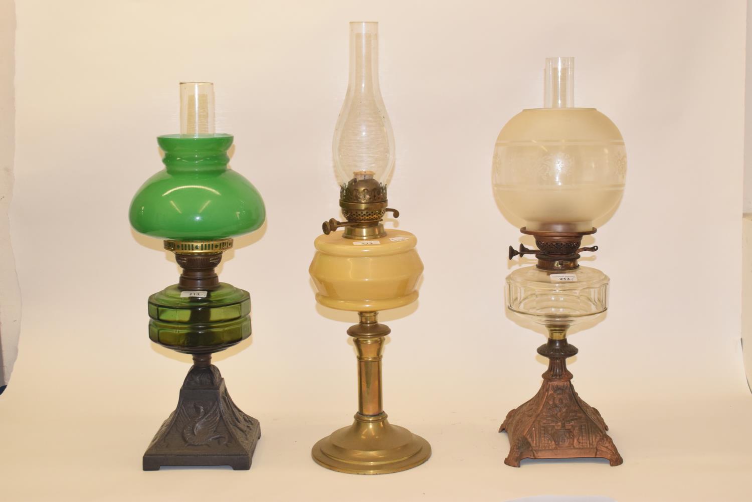 A late 19th/early 20th century glass oil lamp, with clear glass well, and five others (6) - Image 2 of 2