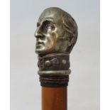 A 19th century fruitwood walking stick, with silver plated handle in the form of the Duke of