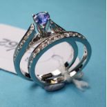 An 18ct white gold, diamond and tanzanite ring, and a matching eternity ring, both approx. ring size