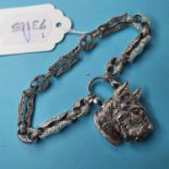 A silver bracelet, with agate set scottie dog lock