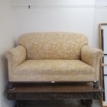 An upholstered two seater sofa