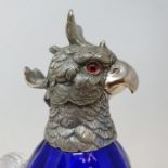 A blue glass decanter, in the form of a parrot, with plated mounts, 28 cm high Report by RB Modern
