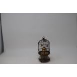 A clock, in the form of a birdcage, 18 cm high Report by RB Modern